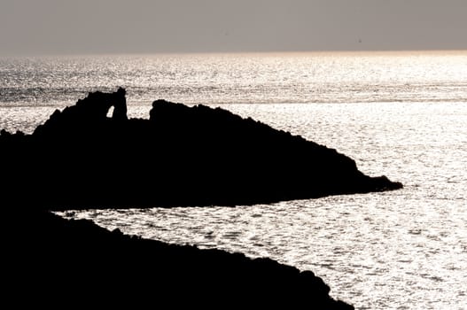 rocky silhouette in sea of patmos island