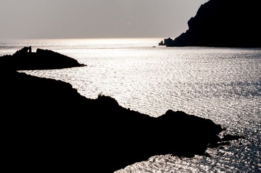 rocky silhouette in sea of patmos island