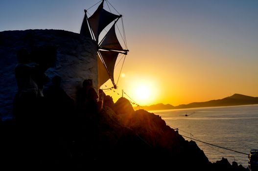 people enjoy the sunset in patmos island