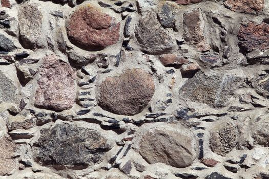 Old weathered stone wall for background or texture