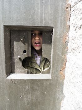 Italy, Bormio, Venini Fort, portrait of a girl inside a fort of the second world war while she is visiting it as a tourist