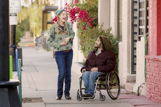 Woman talking with friend in wheelchair