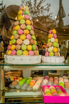 Tower of macarons in Paris in the display window of a shop