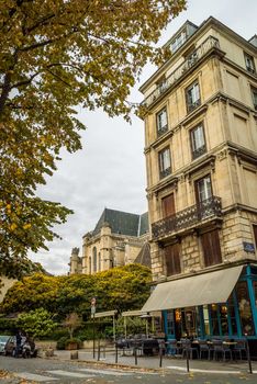 Paris restaurant and church in fall season