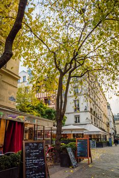 Paris street in Les Halles district with bars and restaurants