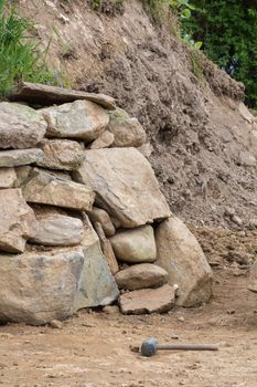 A wall of stones in the garden