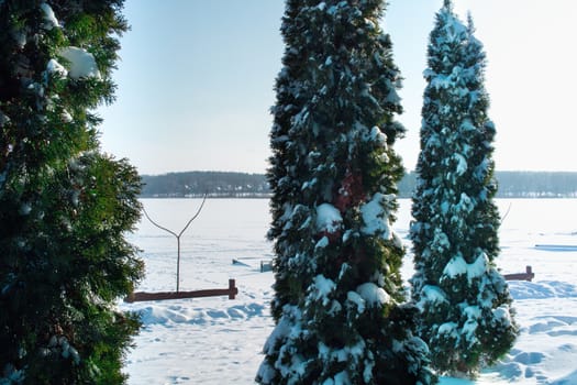 Winter snowee landscape of frozen lake covered with snow and ice