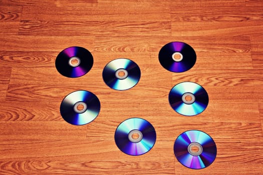 Seven scattered on the floor of the room CDs.