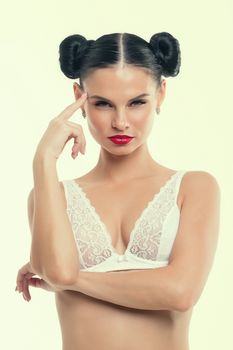 Portrait of a young girl in lingerie with red lipstick.