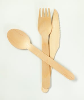 set of wooden cutlery on white background