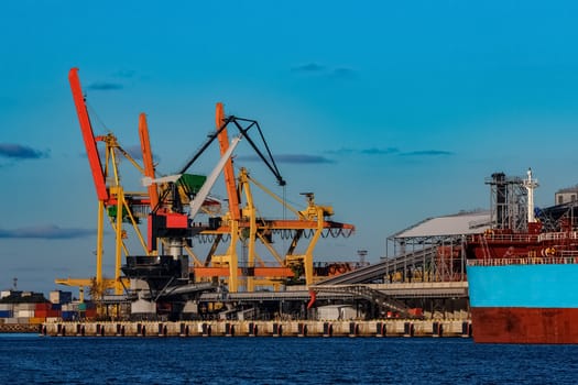 Yellow cargo cranes in the port of Riga, Europe