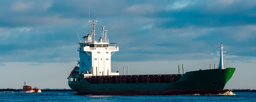 Green bulk carrier sailing from the Baltic sea