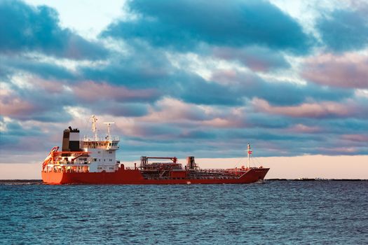 Red cargo oil tanker moving to Baltic sea