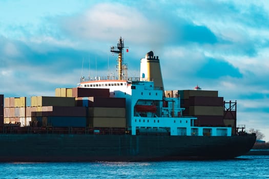 Modern black container ship moving from Baltic sea