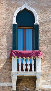 exterior of an old building window and balcony