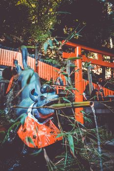 Fox purification fountain at Fushimi Inari Taisha torii shrine, Kyoto, Japan