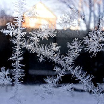 frost on glass on a dark background, macro