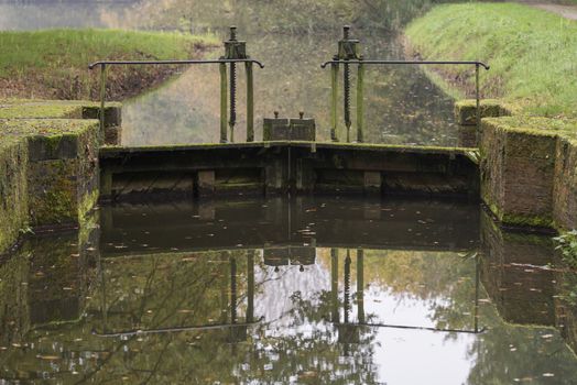 The authentic and monumental lock next to the Mallumse mill in Eibergen in the region Achterhoek in the Netherlands

