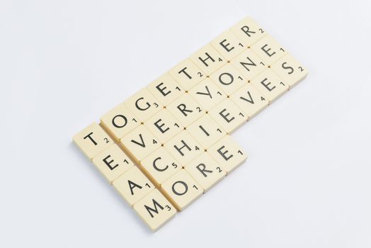 Four scrabble words related to the word team in English
