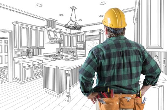 Male Contractor with Hard Hat and Tool Belt Looking At Custom Kitchen Drawing On White.