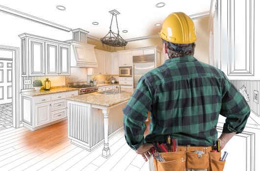 Male Contractor with Hard Hat and Tool Belt Looking At Custom Kitchen Drawing Photo Combination On White.