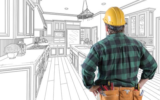 Male Contractor with Hard Hat and Tool Belt Looking At Custom Kitchen Drawing On White.