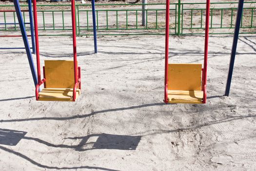 Children swing in the park. Colorful swing, photo