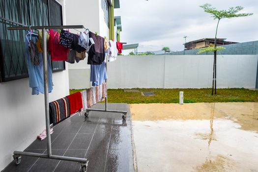 Hanging wet clothes at rainy monsoon season in South East Asia