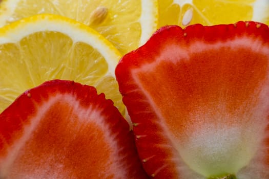 Close up view of sliced lemons and strawberries