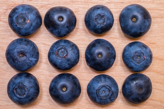 Overhead view of fresh blueberries arranged on a table top