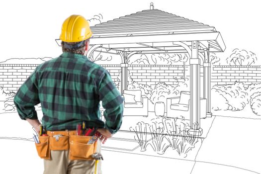 Contractor Standing Looking At Patio Pergola Design Drawing.
