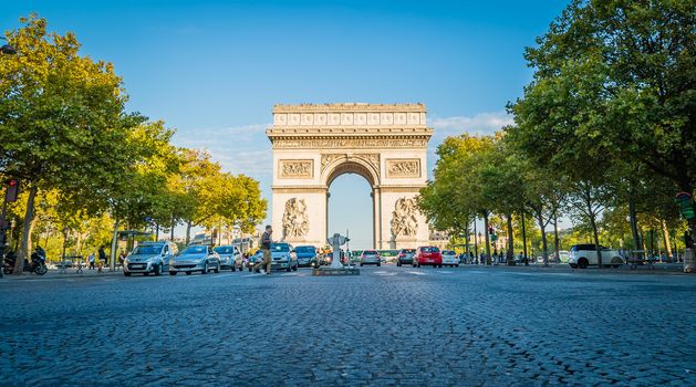 Arc de triomphe in Paris at sunset in the summer