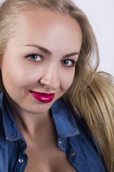 Portrait of a young beautiful blonde woman with blue eyes