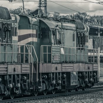 Old diesel cargo locomotive. Freight train in action