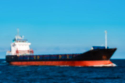 Cargo ship - soft lens bokeh image. Defocused background