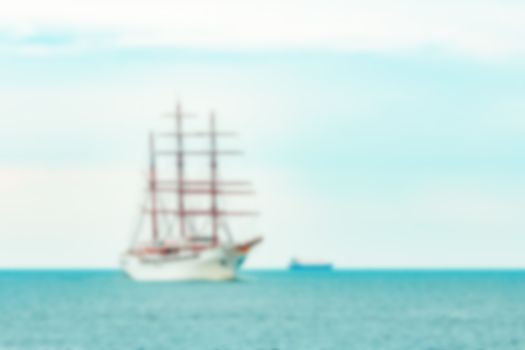 White sailing ship - soft lens bokeh image. Defocused background