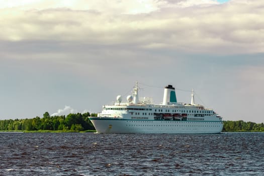 White cruise liner in Riga city. Tour travel and spa services