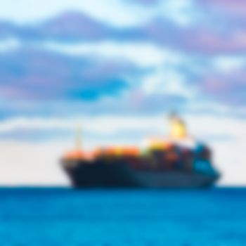 Cargo ship - soft lens bokeh image. Defocused background