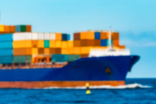 Blue cargo ship - soft lens bokeh image. Defocused background