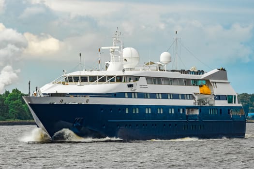 Small blue passenger ship sailing in Baltic sea. Spa services