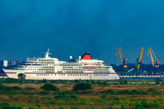 White cruise liner in Riga city. Tour travel and spa services