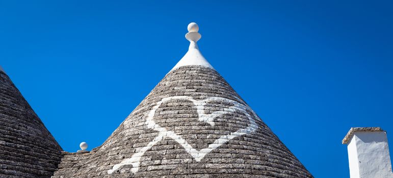 Alberobello, Puglia Region, South of Italy. Traditional roofs of the Trulli, original and old houses of this region.