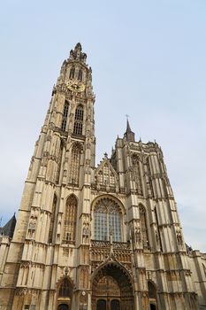 Medieval gothic cathedral of Our Lady in Antwerp, Belgium over clear blue sky, low angle front view