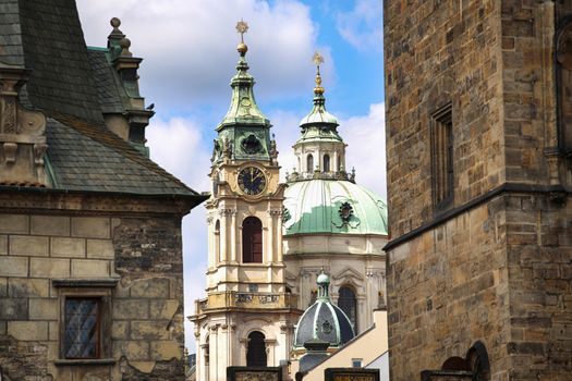 View of Cathedral of Saint Nicolas ( in Mala Strana district) from the Charles Bridge (Karluv Most) in Prague, Czech Republic