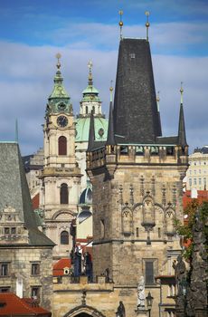 View of the Lesser Bridge Tower and Cathedral of Saint Nicolas from the Charles Bridge (Karluv Most) in Prague, Czech Republic 
