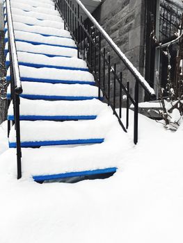 Townhouse staircase covered in snow. Winter in Montreal, Quebec.