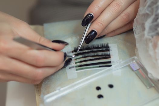 Eyelash Extension Procedure. Woman Eye with Long Eyelashes. Lashes, close up, macro, selective focus