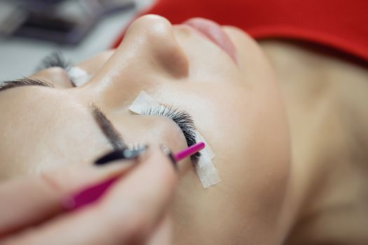 Eyelash Extension Procedure. Woman Eye with Long Eyelashes. Lashes, close up, macro, selective focus