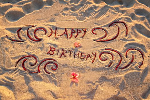 Handwritten on the sand "Happy birthday"