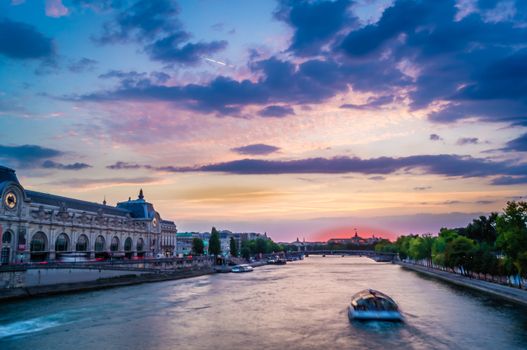 Blue sunset over Orsay Museum and Seine river in Paris